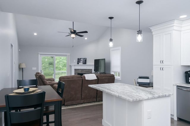 10 Soucy Dr Unit 10, Rutland, MA 01543 - kitchen featuring stainless steel dishwasher, vaulted ceiling, white cabinets, a kitchen island, and ceiling fan