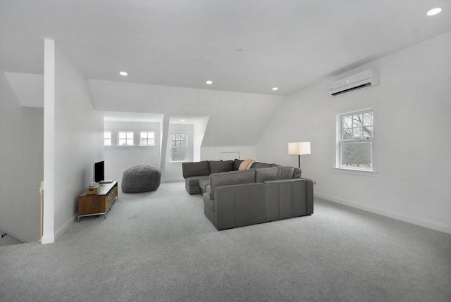 carpeted living room with recessed lighting, a wall mounted air conditioner, baseboards, and vaulted ceiling