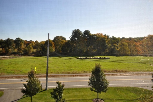 view of home's community featuring a lawn