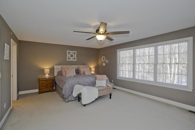 bedroom featuring ceiling fan and light carpet