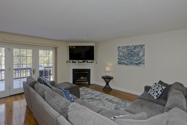 living room featuring french doors and hardwood / wood-style floors