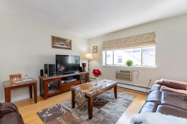 115 Highland Ave Unit 21, Somerville, MA 02143 - living room featuring baseboard heating, a wall mounted air conditioner, and light wood finished floors