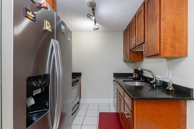 115 Highland Ave Unit 21, Somerville, MA 02143 - kitchen featuring stainless steel fridge with ice dispenser, a sink, dark countertops, brown cabinets, and light tile patterned flooring