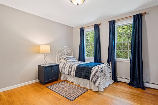 21 Boutwell, Andover, MA 01810 - bedroom with light wood-type flooring and a baseboard heating unit