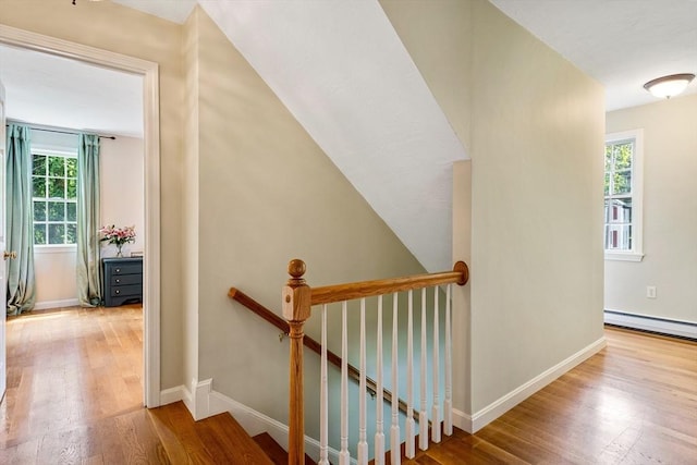 21 Boutwell, Andover, MA 01810 - stairs featuring a baseboard heating unit and wood finished floors