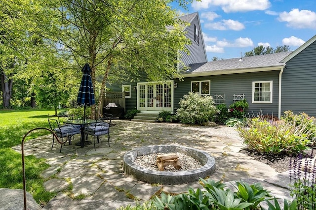 21 Boutwell, Andover, MA 01810 - view of patio / terrace with an outdoor fire pit and french doors