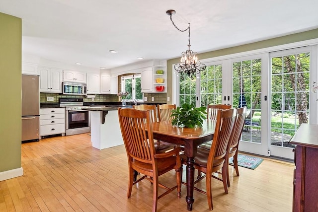 21 Boutwell, Andover, MA 01810 - dining space with light wood-style floors, a chandelier, recessed lighting, and french doors