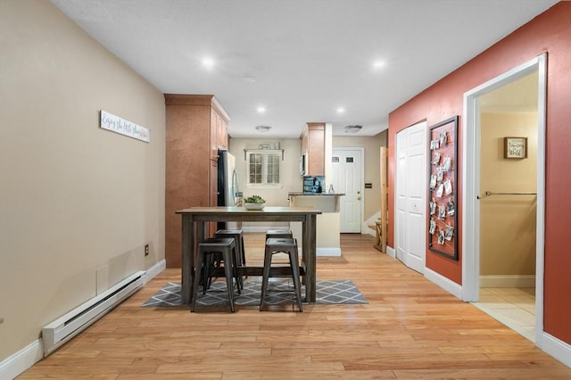 9 Adam St Unit 12, Easton, MA 02375 - dining space with a baseboard radiator, light wood finished floors, baseboards, and recessed lighting