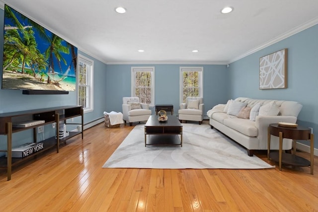 living room featuring wood finished floors, baseboards, ornamental molding, and recessed lighting