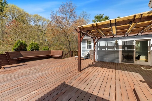 wooden deck featuring a pergola