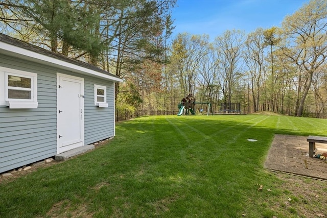 view of yard with a playground and an outdoor structure