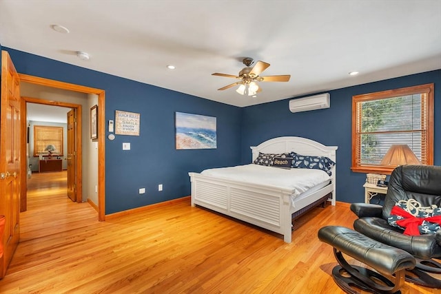 bedroom with baseboards, ceiling fan, a wall mounted air conditioner, light wood-type flooring, and recessed lighting