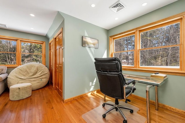 office space featuring light wood-type flooring, baseboards, visible vents, and recessed lighting