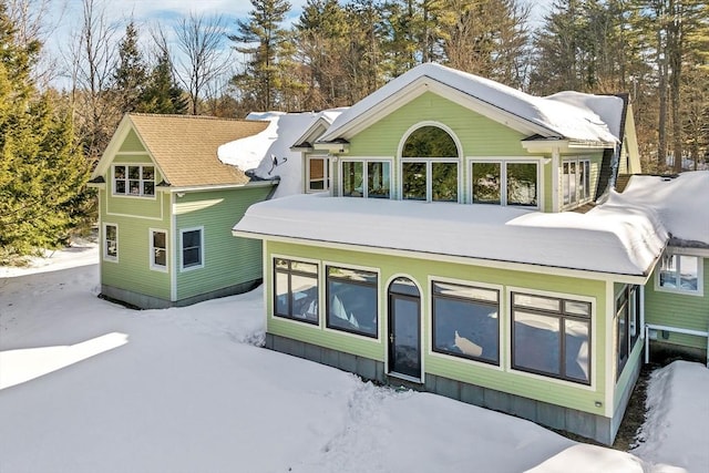 view of snow covered property