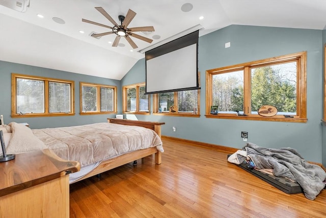 bedroom featuring lofted ceiling, hardwood / wood-style flooring, baseboards, and recessed lighting