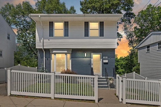 159 Glenellen Rd, Boston, MA 02132 - view of front of home with brick siding and a fenced front yard