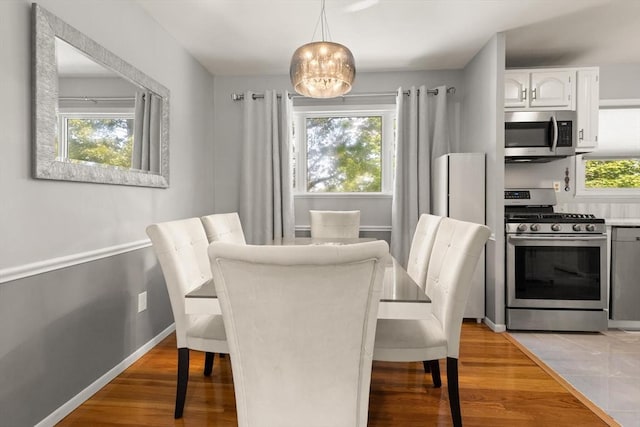 159 Glenellen Rd, Boston, MA 02132 - dining area with light wood-style floors