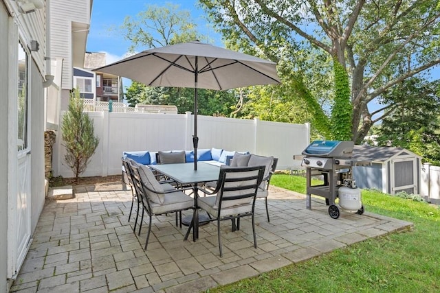 159 Glenellen Rd, Boston, MA 02132 - fenced backyard featuring outdoor dining area, a patio area, grilling area, and a storage unit