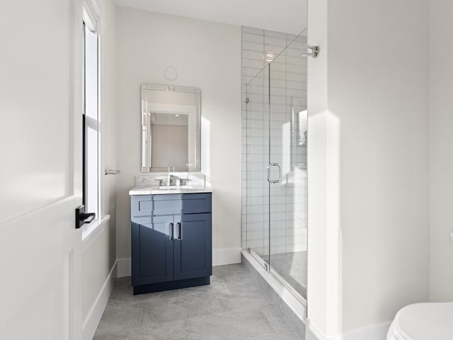 108 Glen St, Natick, MA 01760 - bathroom featuring a shower stall, vanity, toilet, and baseboards