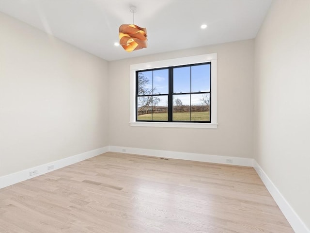 108 Glen St, Natick, MA 01760 - unfurnished room with wood finished floors, baseboards, and recessed lighting