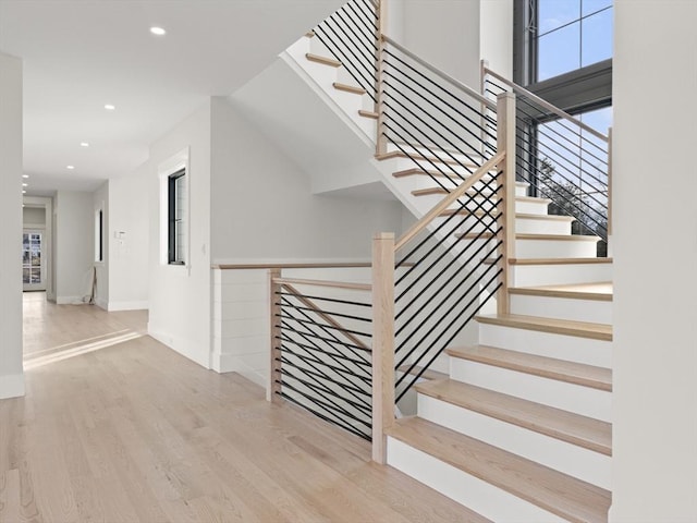 108 Glen St, Natick, MA 01760 - stairs featuring recessed lighting, wood finished floors, and baseboards