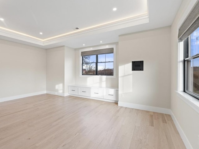 108 Glen St, Natick, MA 01760 - spare room featuring a raised ceiling, light wood finished floors, baseboards, and recessed lighting