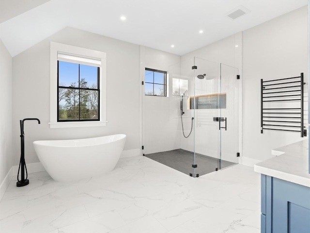108 Glen St, Natick, MA 01760 - full bath featuring marble tiled floors, a freestanding tub, a stall shower, and recessed lighting