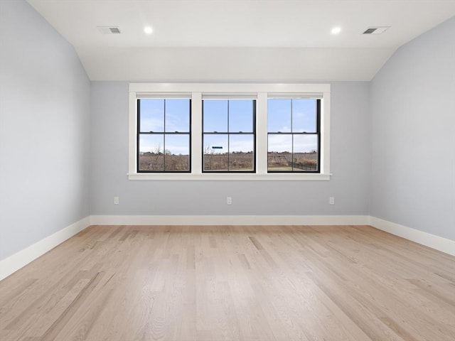 108 Glen St, Natick, MA 01760 - spare room featuring lofted ceiling, healthy amount of natural light, light wood finished floors, baseboards, and recessed lighting