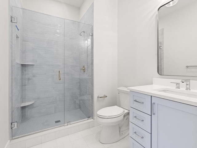 108 Glen St, Natick, MA 01760 - full bath with tile patterned floors, toilet, a shower stall, and vanity