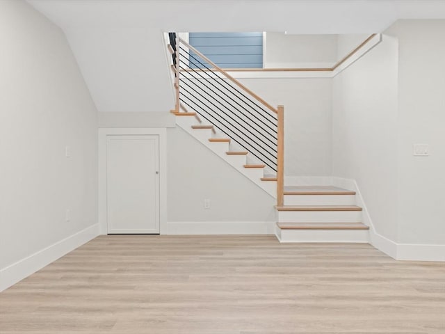 108 Glen St, Natick, MA 01760 - stairs featuring baseboards, wood finished floors, and vaulted ceiling