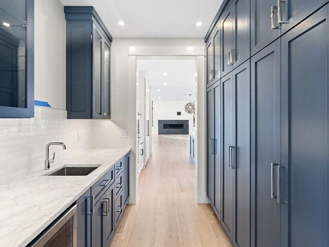 108 Glen St, Natick, MA 01760 - bar area with light wood finished floors, a sink, recessed lighting, backsplash, and wine cooler