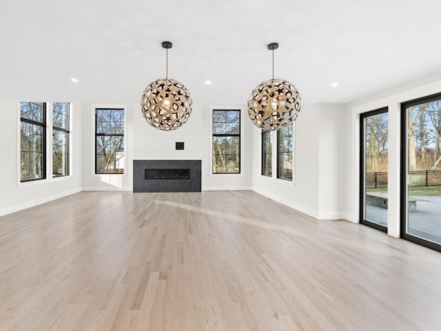 108 Glen St, Natick, MA 01760 - unfurnished living room featuring plenty of natural light, baseboards, light wood-style floors, and recessed lighting