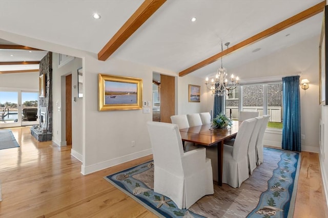 dining area featuring baseboards, a chandelier, recessed lighting, and light wood-type flooring