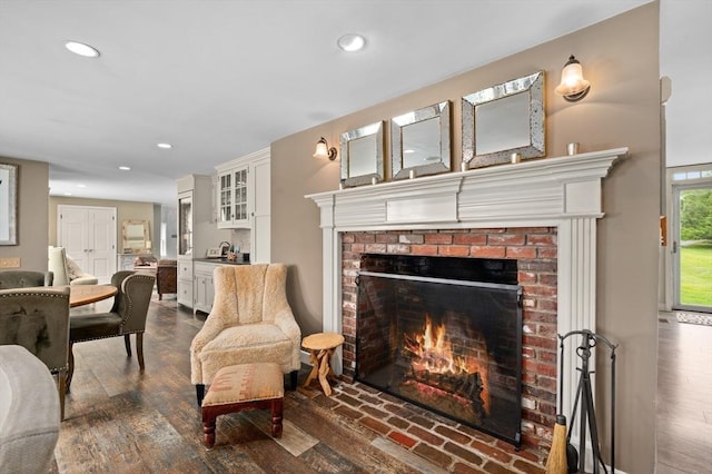 46 Baldpate Rd, Boxford, MA 01921 - living area with a brick fireplace, recessed lighting, and dark wood finished floors