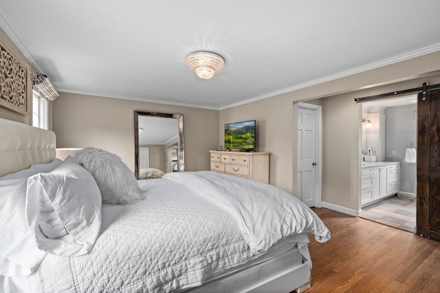 46 Baldpate Rd, Boxford, MA 01921 - bedroom with a barn door, light wood-style flooring, crown molding, and ensuite bathroom