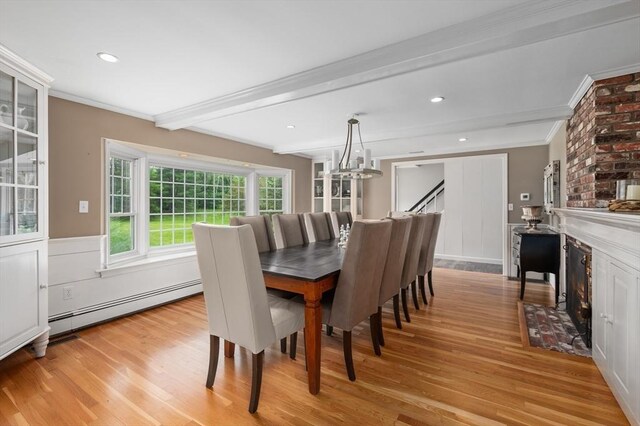 46 Baldpate Rd, Boxford, MA 01921 - dining area with a baseboard heating unit, light wood finished floors, a chandelier, ornamental molding, and stairs
