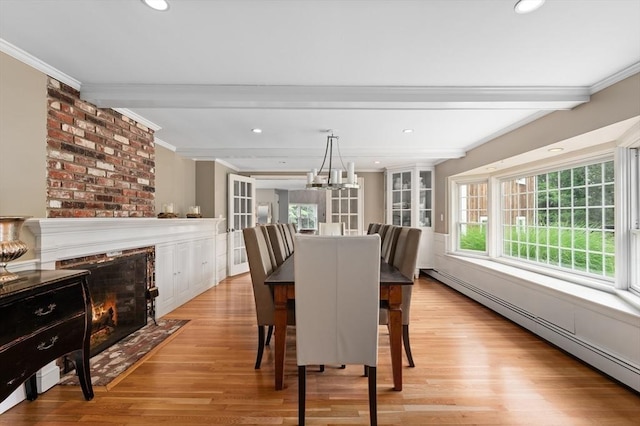 46 Baldpate Rd, Boxford, MA 01921 - dining area featuring a baseboard radiator, crown molding, beamed ceiling, light wood-style flooring, and a chandelier
