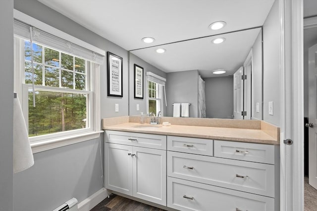 46 Baldpate Rd, Boxford, MA 01921 - full bath featuring vanity, healthy amount of natural light, recessed lighting, a baseboard radiator, and wood finished floors