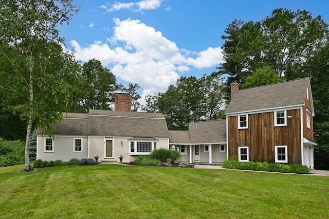 46 Baldpate Rd, Boxford, MA 01921 - view of front of house featuring a chimney, a front yard, and a shingled roof