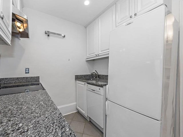 227 Marlborough St Unit 4, Boston, MA 02116 - kitchen featuring white appliances, a sink, white cabinetry, light tile patterned floors, and baseboards
