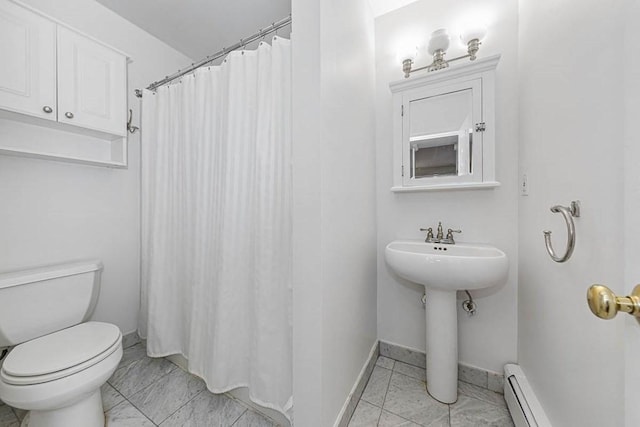 227 Marlborough St Unit 4, Boston, MA 02116 - bathroom featuring toilet, baseboard heating, baseboards, marble look tile flooring, and curtained shower