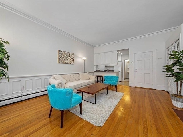 227 Marlborough St Unit 4, Boston, MA 02116 - living room with ornamental molding, light wood-style flooring, and a baseboard radiator