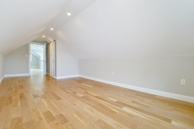bonus room with recessed lighting, vaulted ceiling, light wood-type flooring, and baseboards