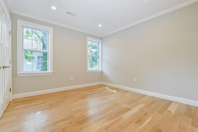 empty room with light wood-style flooring, baseboards, ornamental molding, and recessed lighting