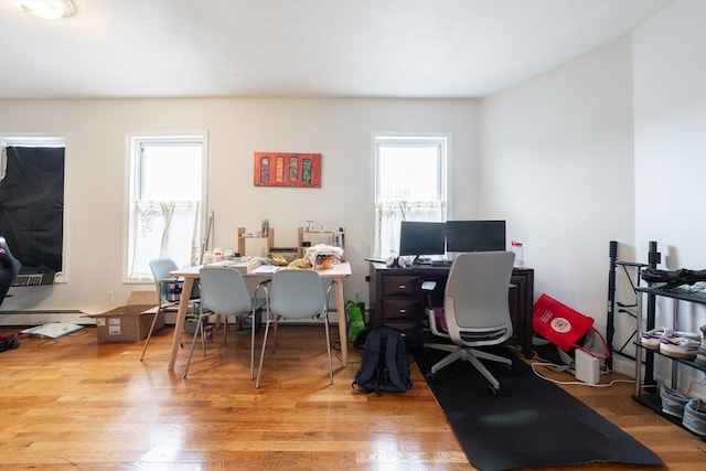 309 Elm St Unit 3, Cambridge, MA 02139 - home office with baseboard heating and wood finished floors