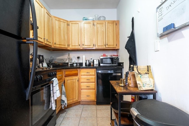 309 Elm St Unit 3, Cambridge, MA 02139 - kitchen featuring black appliances, dark countertops, light tile patterned floors, and light brown cabinetry