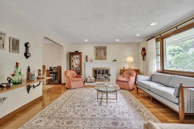27 Philip Rd, Lexington, MA 02421 - living room featuring wood finished floors, a fireplace, and recessed lighting