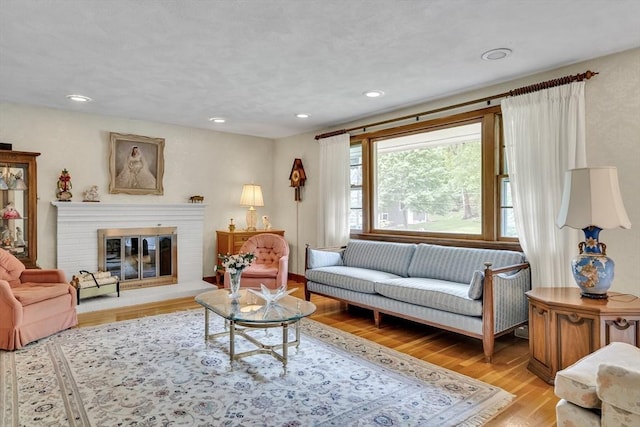 27 Philip Rd, Lexington, MA 02421 - living room with light wood-style flooring, recessed lighting, and a fireplace