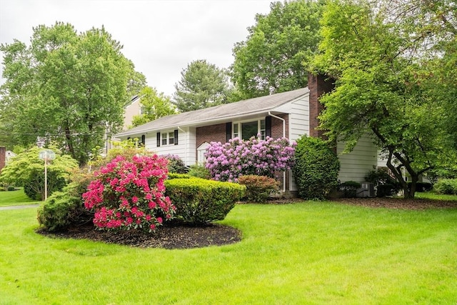 27 Philip Rd, Lexington, MA 02421 - view of front facade with a front lawn and a chimney