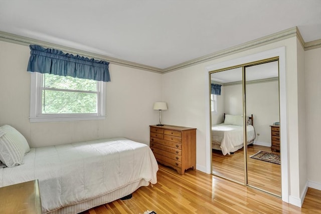 27 Philip Rd, Lexington, MA 02421 - bedroom with light wood-style floors, a closet, ornamental molding, and baseboards
